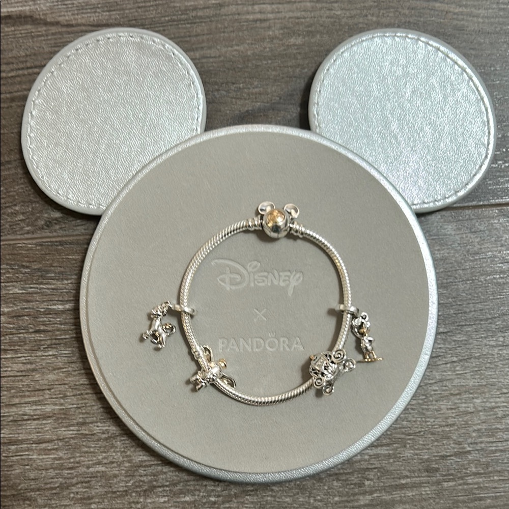 Pandora Disney 100 bracelet with 4 charms